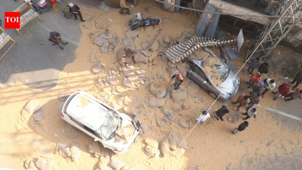 Ludhiana chaos: Overloaded truck topples, wheat sacks fall from flyover; vehicles damaged, 2 injured | Ludhiana News