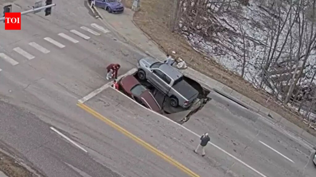 Watch: Massive sinkhole opens up on Nebraska road, swallows two vehicles; leaves bystanders stunned