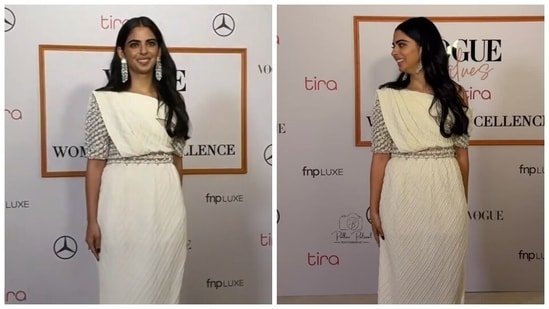 Isha Ambani styles saree-inspired white Chanel gown with massive diamond earrings and rings at star-studded event. Watch