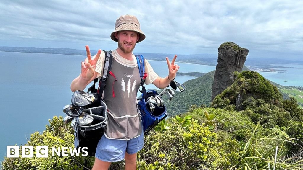 Golf caddy taking clubs length of New Zealand faces ‘hardest weeks’