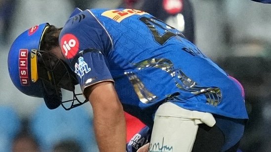 Double whammy: Before being retired-hurt, Rohit Sharma left flabbergasted during the bat test at the MI-RCB showdown