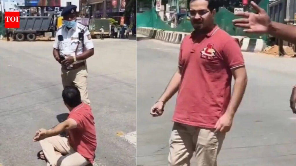 Man sits on road as pregnant wife ‘trapped’ in traffic jam after VIP convoy stops vehicles in Bengaluru | Bengaluru News