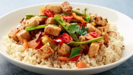 Quick Tofu Vegetable Stir Fry For A Nutritious Plant-Based Meal With Peanut Sauce And Fresh Produce