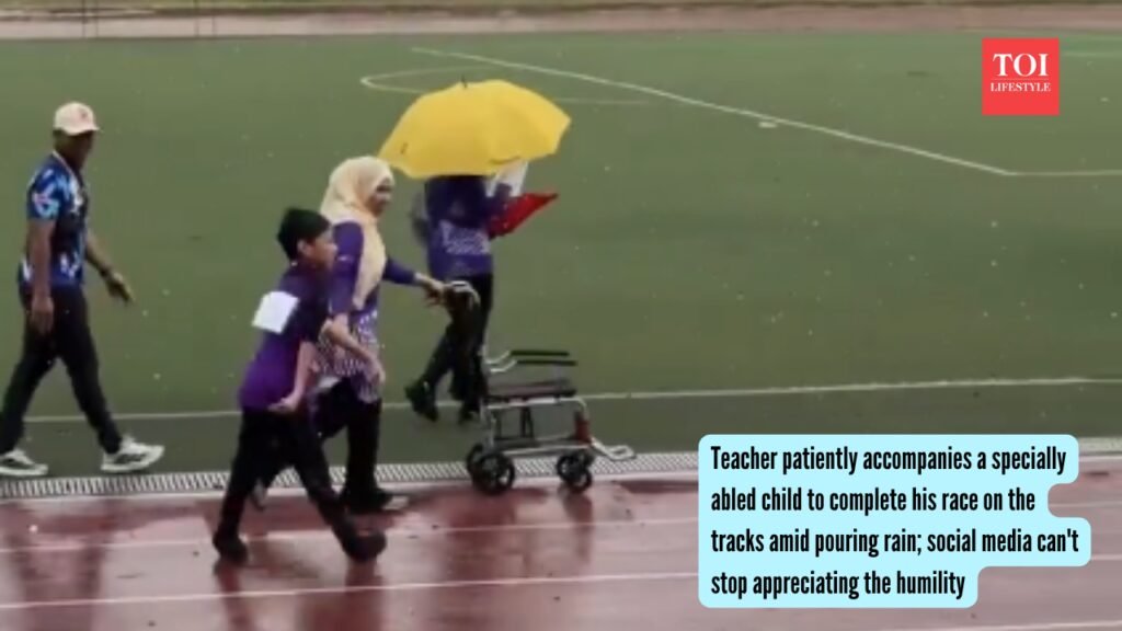 Teacher patiently accompanies a specially abled child to complete his race on the tracks amid pouring rain; social media can’t stop appreciating the humility |