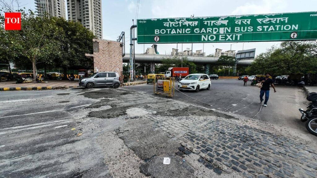 Noida repairs damaged speed breakers at Botanical Garden bus stand | Noida News
