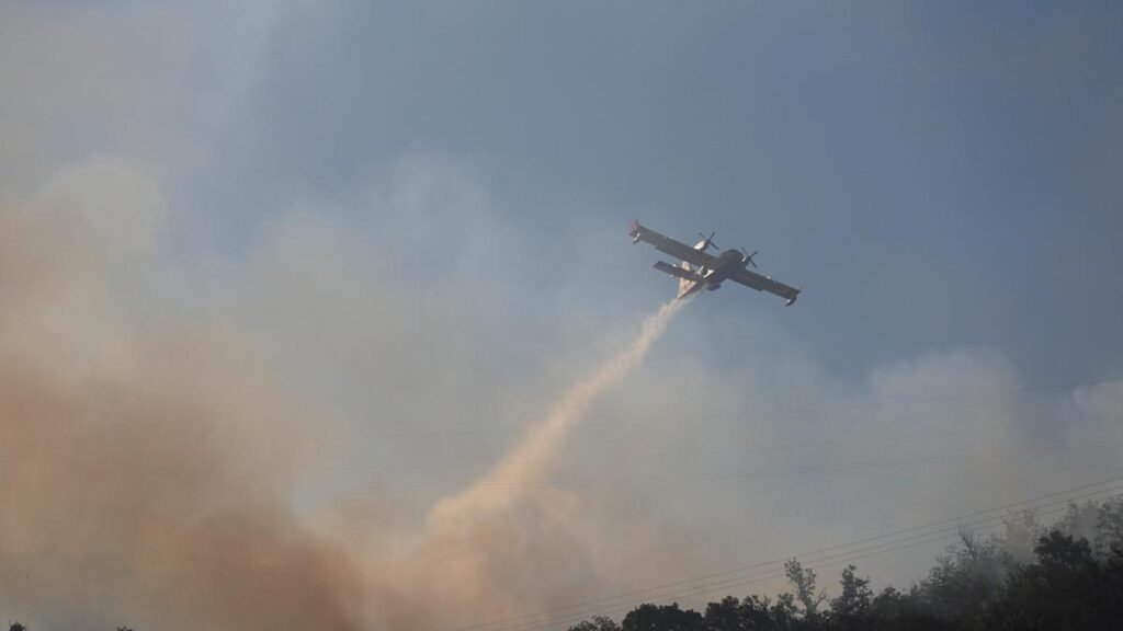 Thousands flee raging wildfires in southern Europe
