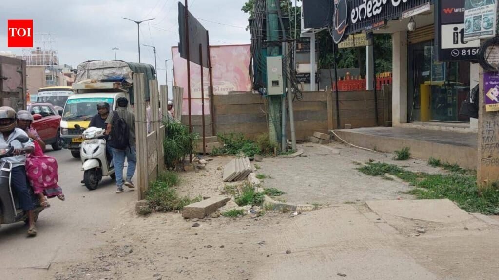 Old Airport Road footpaths leave Bengaluru’s pedestrians with nowhere to walk | Bengaluru News