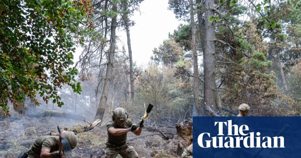 ‘It’s been very tough’: hope of progress in gruelling battle against south Wales wildfire | Wales
