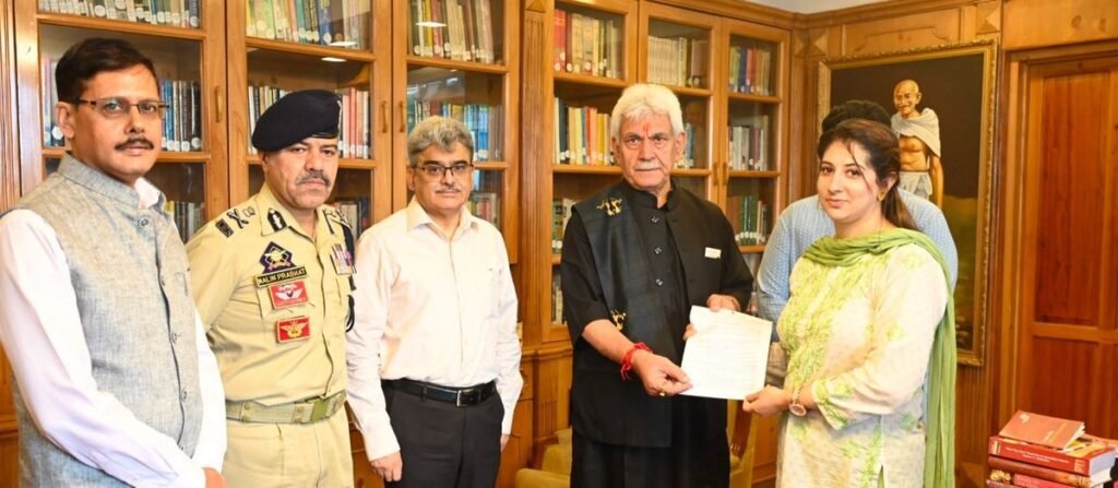 LG Sinha hands-over appointment letter to wife of J&K Police Inspector Masroor Ali Wani