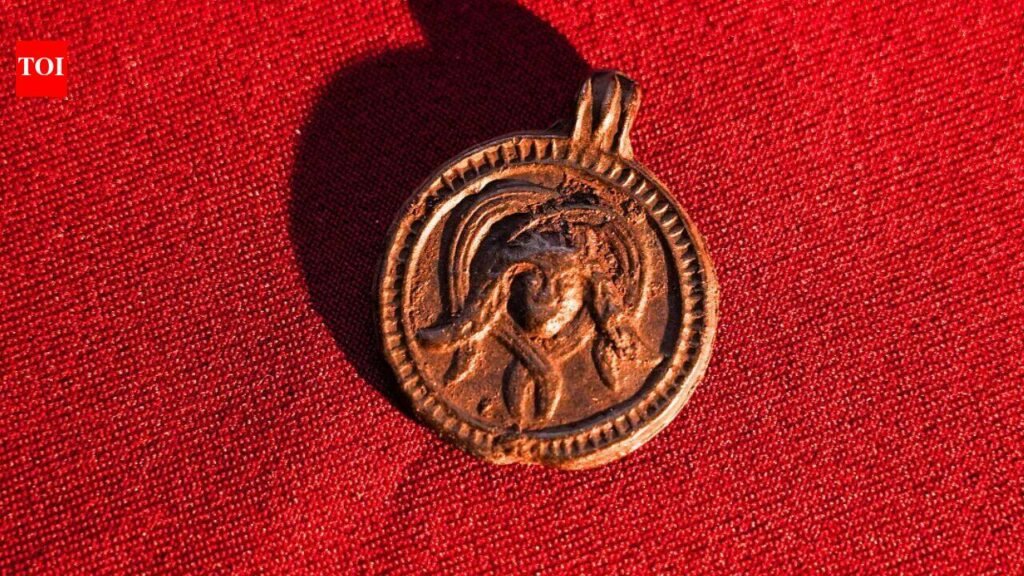 Archaeologists found an 11th-century pendant in Russia showing a Christian saint and a Medusa-like figure | World News