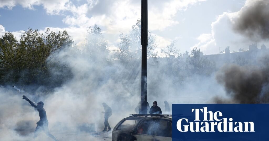 Police clash with protesters as tens of thousands take to streets across France | France