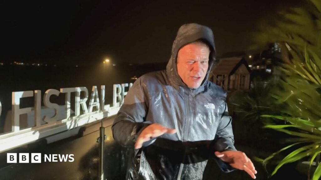 Storm Austen: Presenter battles strong winds as storm hits Cornwall