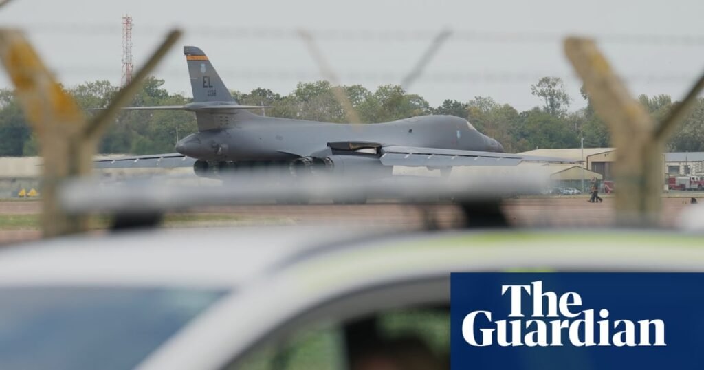 Two men charged over alleged plot to assist Iran after RAF Fairford incident | UK news