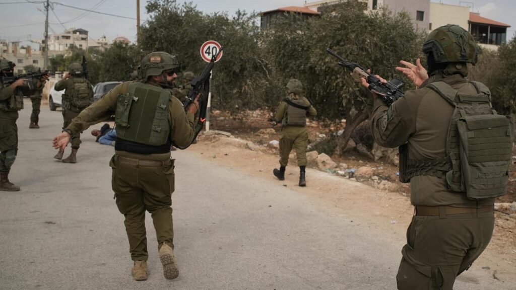 Israeli settlers burn olive trees, injure journalist in West Bank attack